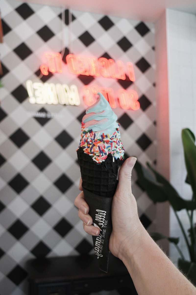 little damage person holding holding flavored ice cream united states